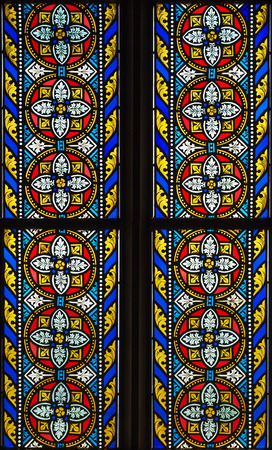 stained-glass window with symmetrical decorative geometric patternsの写真素材