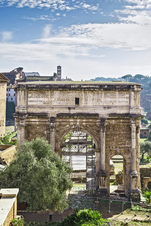 The white marble Arch of Septimius Severus at the Roman Forum is a triumphal arch dedicated in AD 203 to commemorate the Parthian victories of Emperor Septimius Severus and his two sonsのeditorial素材