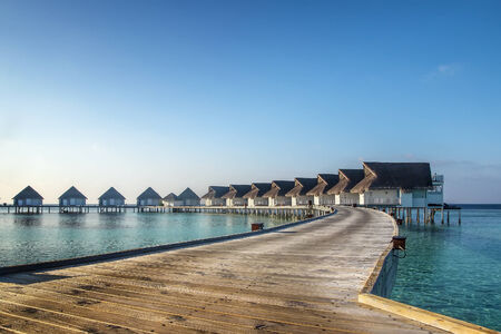 Picturesque bungalows on stilts near the shore of a tropical island, Maldivesのeditorial素材