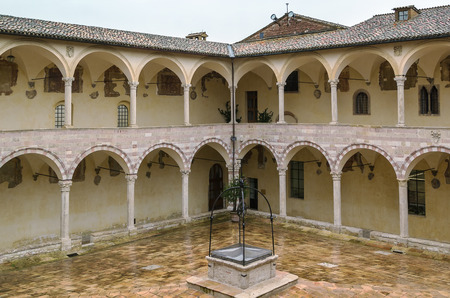 Cloister. The Papal Basilica of St. Francis of Assisi is the mother church of the Roman Catholic Franciscan Order in Assisi, Italy.のeditorial素材