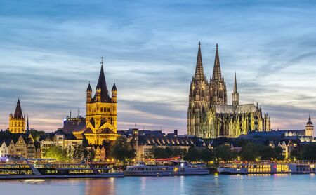 view of historical center of Cologne from Rhine river in evening, Germanyのeditorial素材