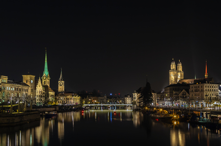 Limmat river with view of church in Zurich in evening, Switzerlandの写真素材