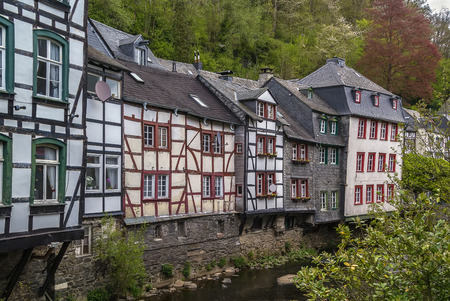 picturesque houses along the Rur River in the historic center of Monschau, Germanyのeditorial素材