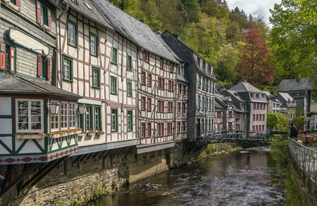 picturesque houses along the Rur River in the historic center of Monschau, Germanyのeditorial素材