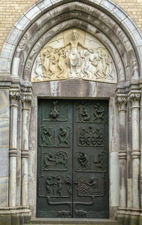 St. Kunibert is the youngest of the Twelve Romanesque churches of Cologne and was consecrated 1247. Portalの写真素材