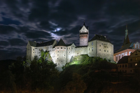 Loket Castle is a 12th-century Gothic style castle located about 12 km from Karlovy Vary on a massive rock in the town of Loket, Czech Republic. Eveningのeditorial素材