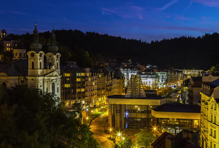 View of Karlovy Vary with Church of St. Mary Magdalene in evening, Czech republicの写真素材