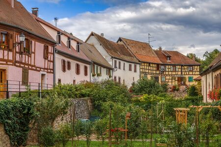 Historical houses and garden in Berghiem, Alsace, Franceの写真素材