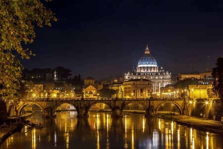 view of Ponte Vittorio Emanuele II and St. Peter's Basilica in evening, Romeの写真素材