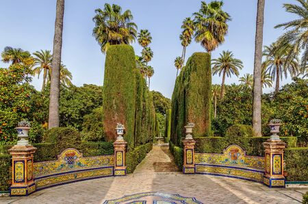 Decorative alleyway in garden in Alcazar of Seville, Spainの写真素材