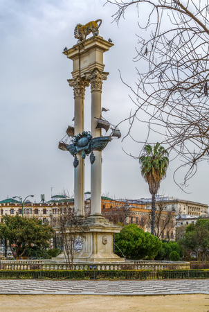 Monument to Columbus, which consists of the caravel Santa Maria between two towering white columns with a lion on top, Seville, Spainのeditorial素材