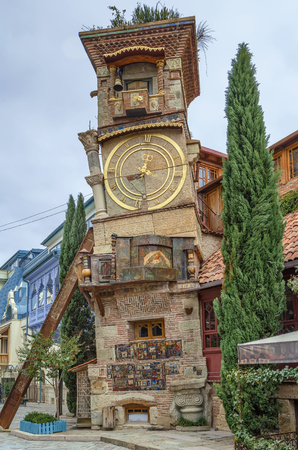 The leaning clock tower is located next to the Gabriadze theater, Tbilisi, Georgiaの写真素材