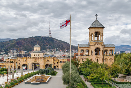 View of the main gate and bell tower on the territory of Holy Trinity Cathedral of Tbilisi, Georgiaの写真素材
