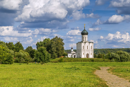 The Church of the Intercession of the Holy Virgin on the Nerl River is an Orthodox church and a symbol of medieval Russia. View from the fieldの写真素材