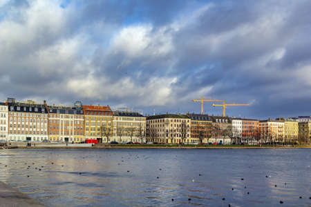 Houses on the embankment of Peblinge lake in Copenhagen, Denmarkの写真素材
