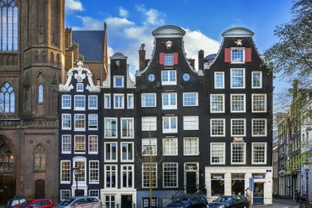 Historical houses on embankment in Amsterdam, Netherlandsの写真素材