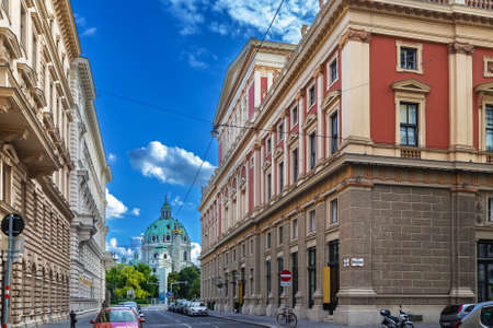 View of street with Musikverein concert hall and St. Charles Church, Vienna, Austriaの写真素材