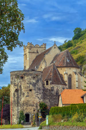 St. Michael church is fortified Gothic church, on the north bank of the Danube, Austriaのeditorial素材