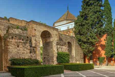 Courtyard at the entrance to Alcazar of Seville with wall from XI century, Spainのeditorial素材