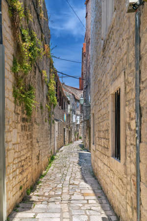 Narrow street in old town of Trogir, Croatiaの写真素材
