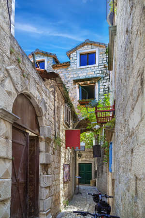 Narrow street in old town of Trogir, Croatiaの写真素材