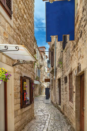 Narrow street in old town of Trogir, Croatiaの写真素材