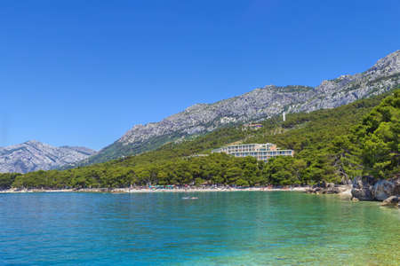 View of the shore of the Adriatic Sea with mountains in the background in the district of Brela, Croatiaの写真素材