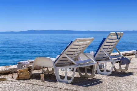 Deck chair on the beach in Brela, Croatiaの写真素材