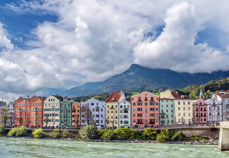 Colorful houses on Embankment of the River Inn in Innsbruck, Austriaの写真素材