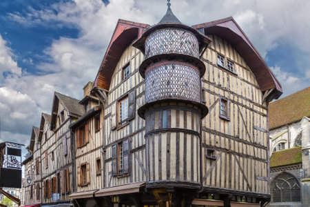 Street with historical half-timbered houses in Troyes city center, France