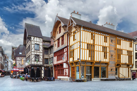Street with historical half-timbered houses in Troyes city center, France