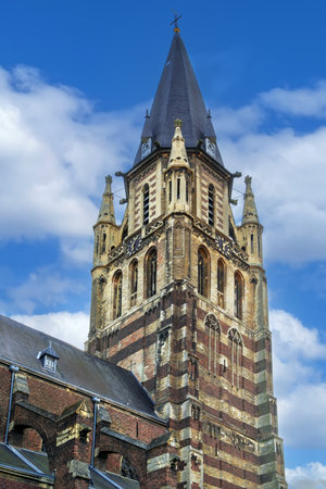 Tower of St Peter's cathedral is gothic basilica in Sittard city center, Netherlandsの写真素材