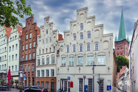 Historic houses on the Trave River embankment in Lubeck city center, Germanyの写真素材