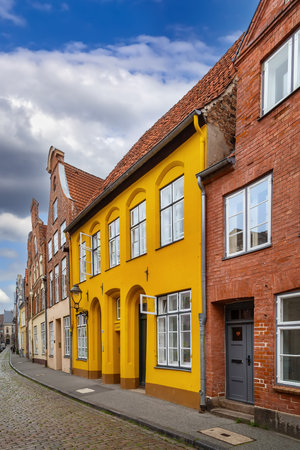 Street with historical houses in Lubeck city center, Germanyの写真素材