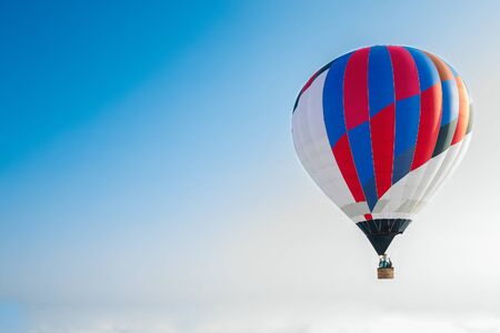 balloon flying through the skyの写真素材