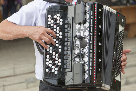 a man plays the accordion close-up, electro accordionの写真素材