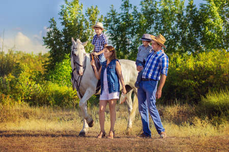 Family walk with a horseの写真素材