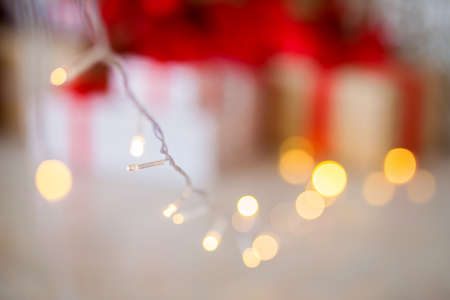 Bokeh, silhouette of gifts, indistinct background Christmas treeの写真素材