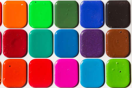 Multi-colored bright Watercolor paints close up. A background from paints.の写真素材
