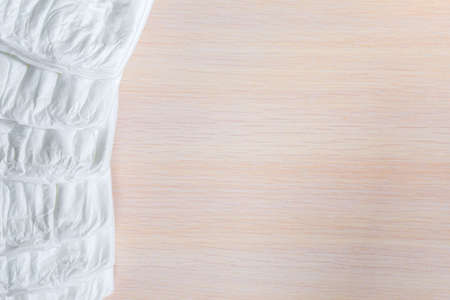 The pack of white children's diapers is put in the form of a frame.の写真素材
