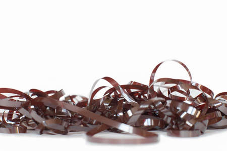 The confused cassette tape on a white background. A frame from a magnetic tape.の写真素材