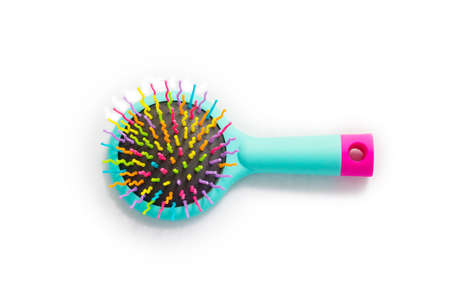 Bright children's Massage hairbrush on a white background it is isolatedの写真素材