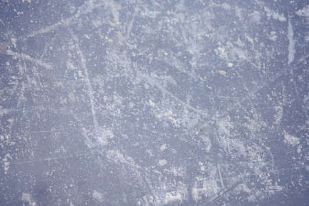 The texture of the ice skating rink, skated, closeup. Open ice rink winter background.の写真素材