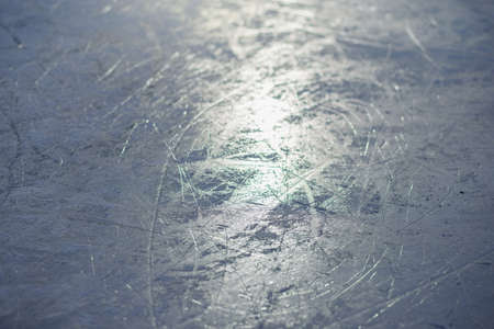 The glare of the winter sun reflected in the ice skating rink for figure skatingの写真素材