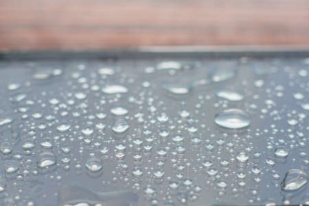 Texture phone which is filled in with water. Drops on the black smartphoneの写真素材