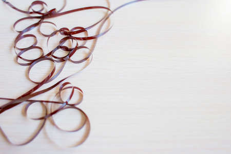 The confused cassette tape on a white background. A frame from a magnetic tape.の写真素材