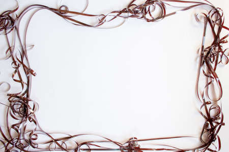 The confused cassette tape on a white background. A frame from a magnetic tape.の写真素材