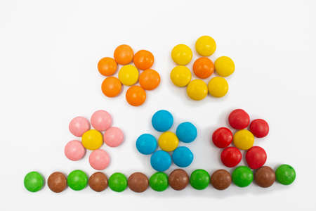 Sweet Floral Arrangement Lined from Multi-Colored Round Dragees of Candiesの写真素材