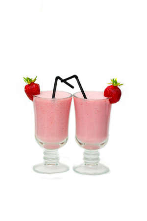 Two glasses of Strawberry milkshake with a tubuleの写真素材