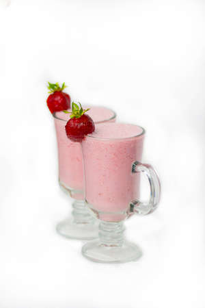 Two glasses of milkshake on a white background.の写真素材
